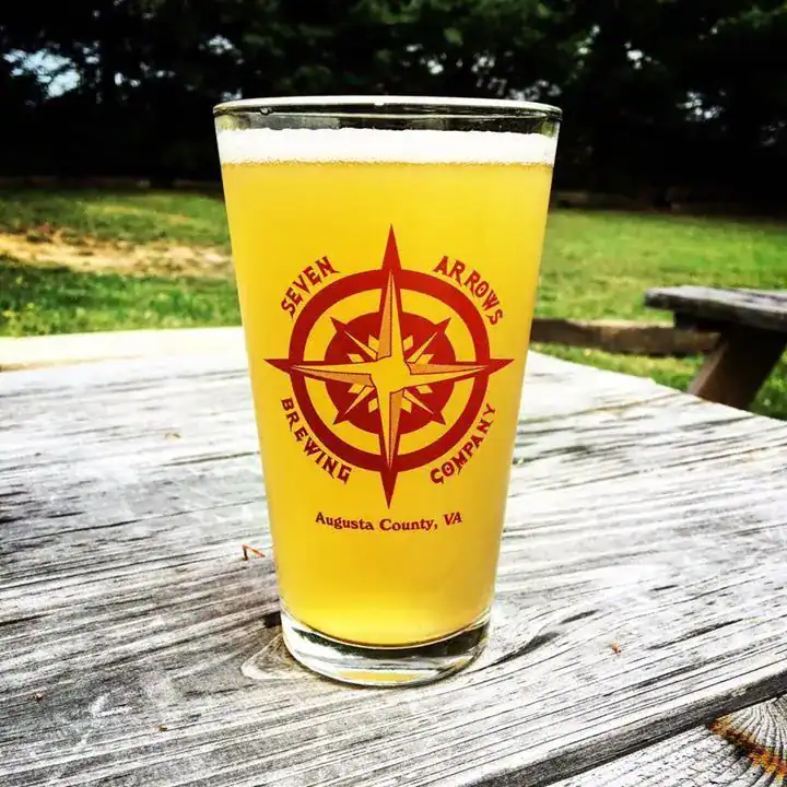 Seven Arrows Pint Glass on Outdoor Picnic Table Seven Arrows Pint Glass on Outdoor Picnic Table